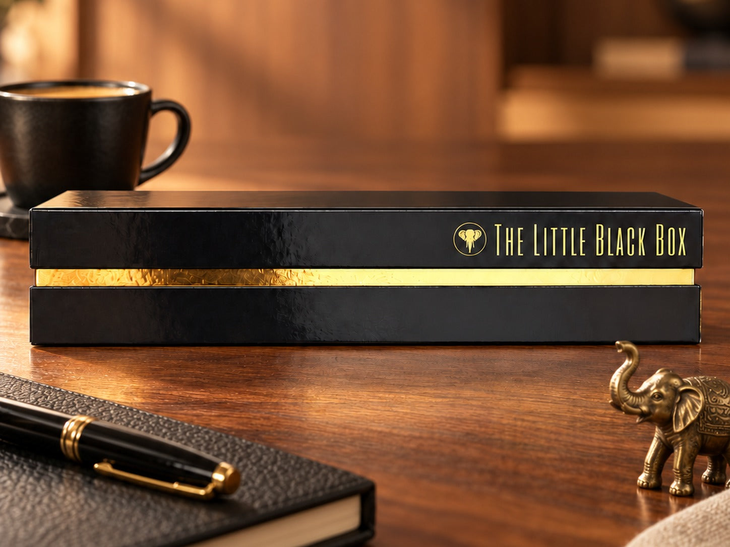 The Little Black Box 2027 in the Archive Box: glossy black with a gold band